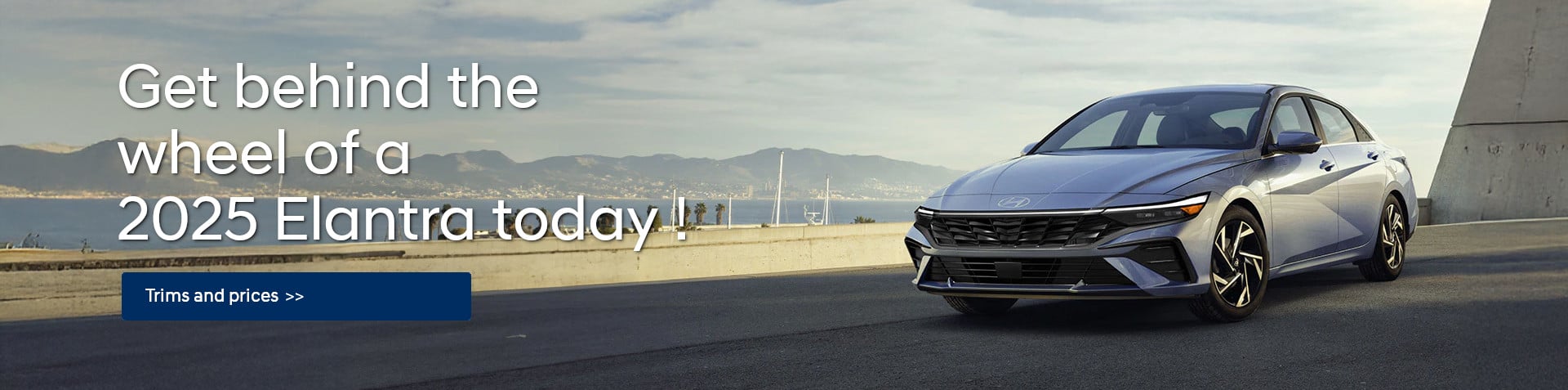 A 2025 Hyundai Elantra parked on e road near a concrete structure