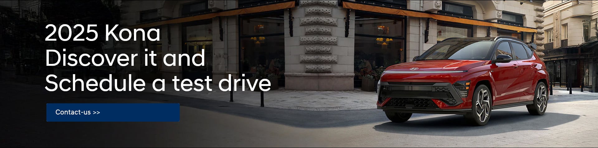 A red 2025 Hyundai Kona is parked on a city street