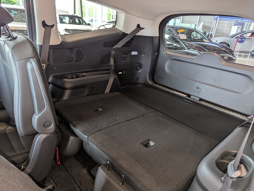 Rear seats folded flat for cargo.