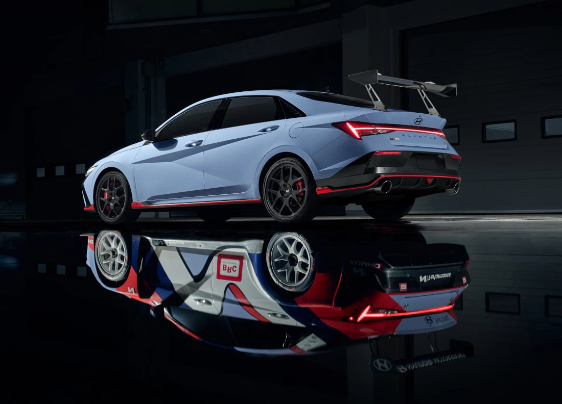 Hyundai 2026 Elantra N TCR whose reflection on the pavement is a racing version of the car
