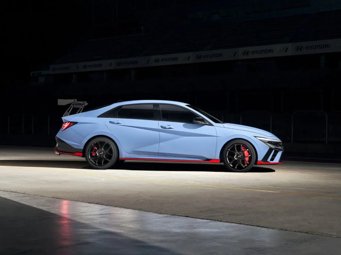 an Elantra N TCR Edition stands on a circuit plunged into darkness