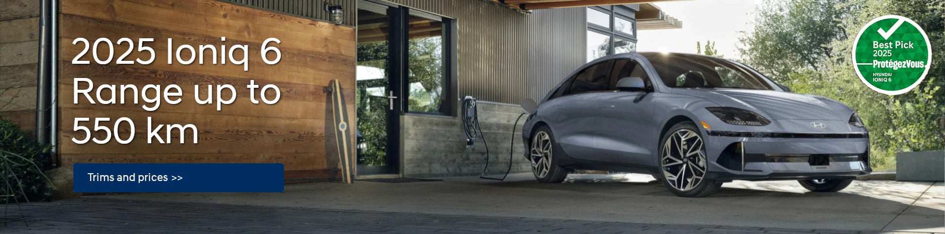 IONIQ 6 2025, plugged in to recharge, parked in front of a house