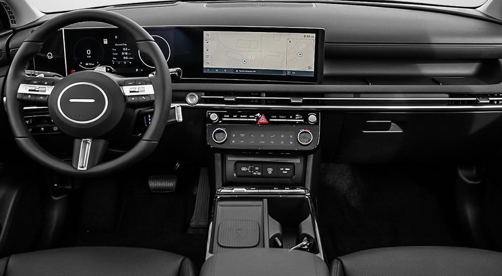 Hyundai Tucson Hybrid Ultimate AWD 2026 Bronze Cashmere vue des sièges avant et du tableau de bord