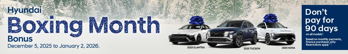 Banner for the Hyundai Boxing Month Bonus event. It shows a 2025 ELANTRA, a 2025 TUCSON, and a 2025 KONA parked on the snow with a snowy woodland in the background. The banner text reads: «Hyundai Boxing Month Bonus. December 5, 2025 to January 2, 2026. Don't pay for 90 days on all models. Based on a monthly payment frequency, finance purchases only. Restrictions apply.»