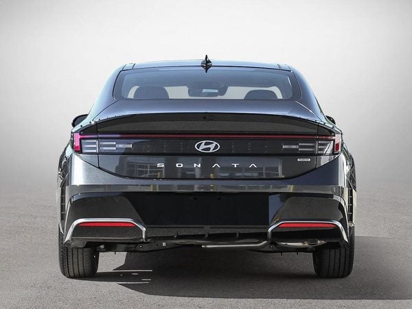 Full rear view of the 2026 Hyundai Sonata Hybrid Preferred Trend in Nocturne Grey.