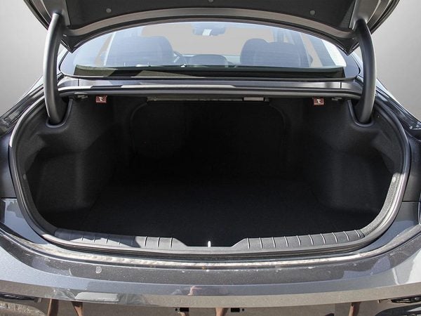 Trunk of the 2026 Hyundai Sonata Hybrid Preferred Trend with the lid open.