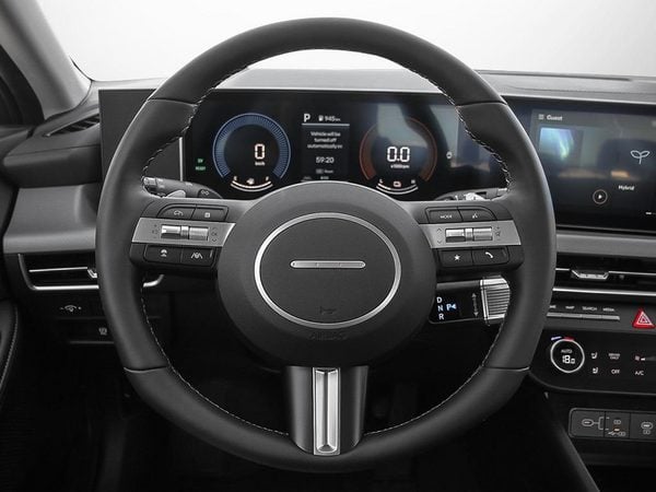 Close-up of the leather steering wheel and its controls on the 2026 Hyundai Sonata Hybrid.
